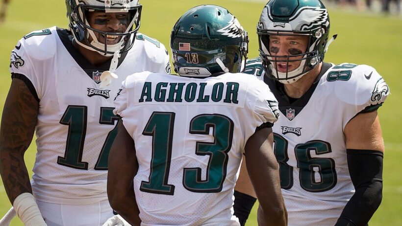 Three Philadelphia Eagles celebrating