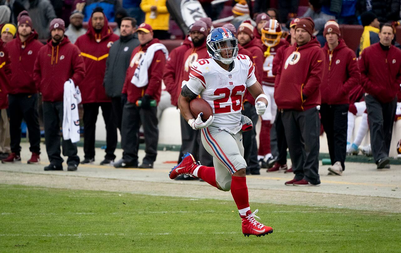 Saquon Barkley runs into the end zone.