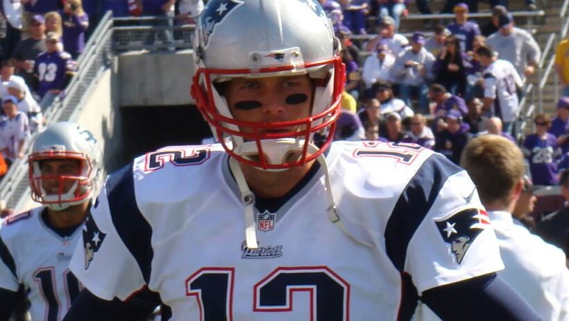 Tom Brady on the field with the New England Patriots