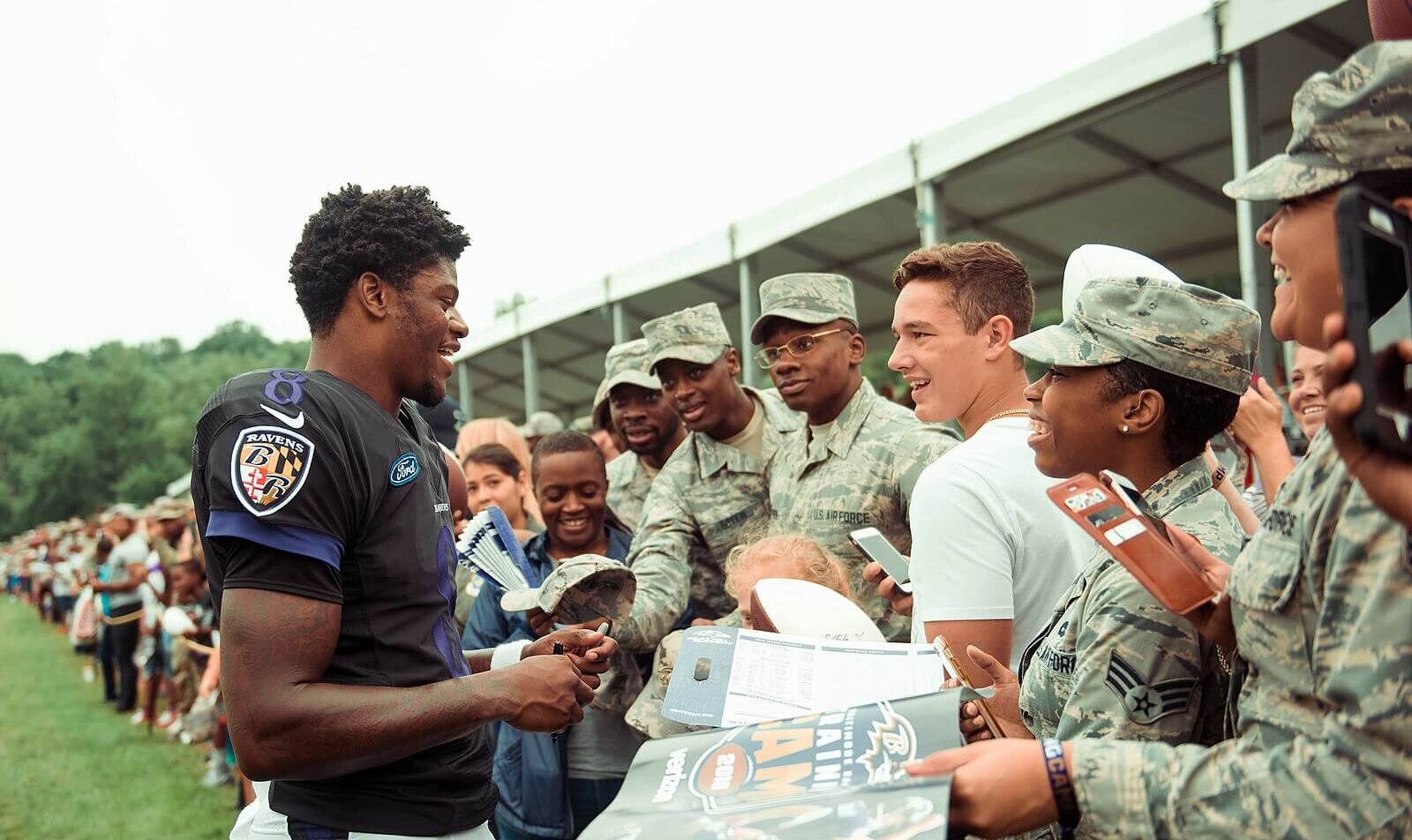 Lamar Jackson interacts with troops