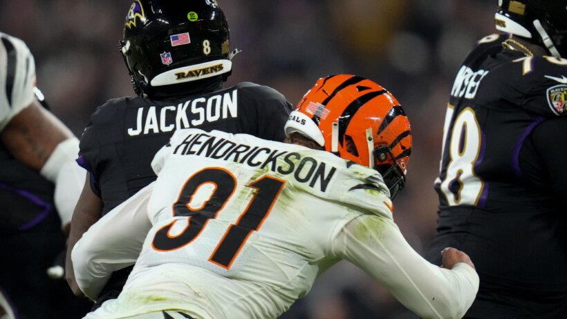 Cincinnati Bengals defensive end Trey Hendrickson sacks Baltimore Ravens quarterback Lamar Jackson