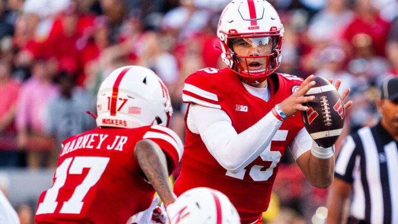 Nebraska Cornhuskers quarterback Dylan Raiola hands the ball off to wide receiver Jacory Barney Jr.