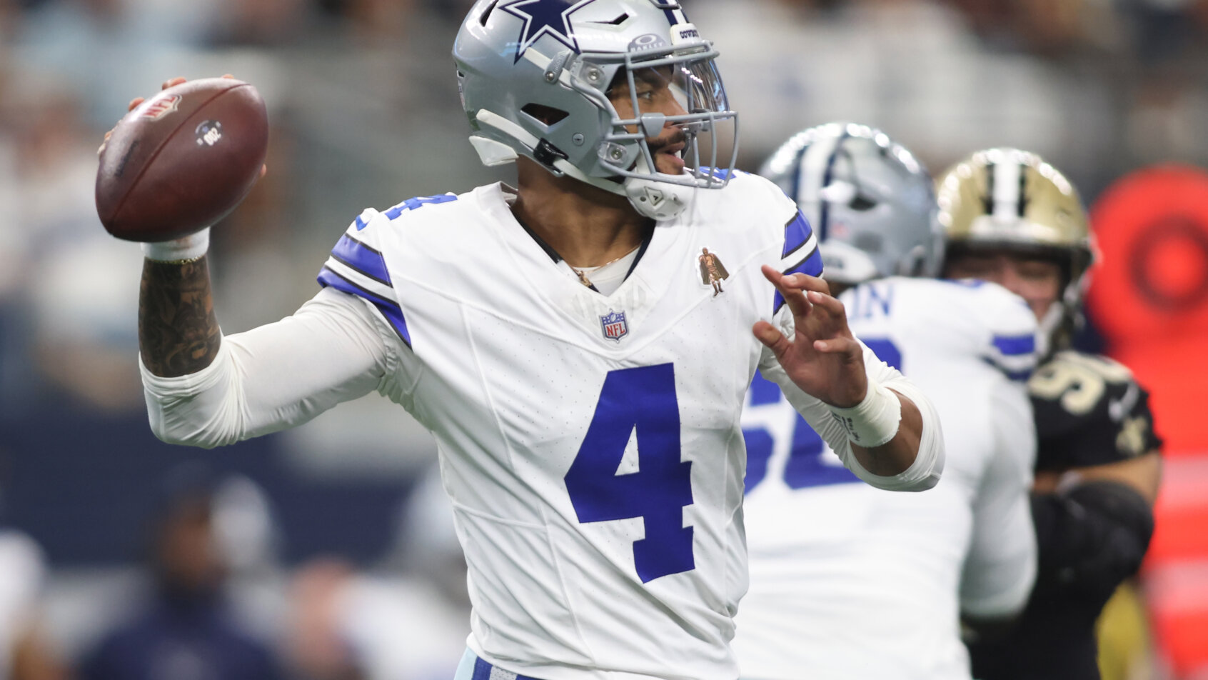 Dak Prescott gets set to throw a pass versus the Saints.