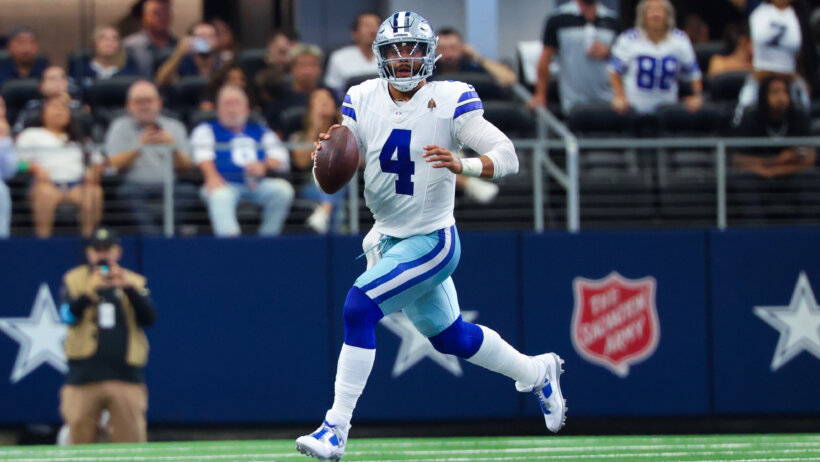 Dallas Cowboys quarterback Dak Prescott scrambles out of the pocket