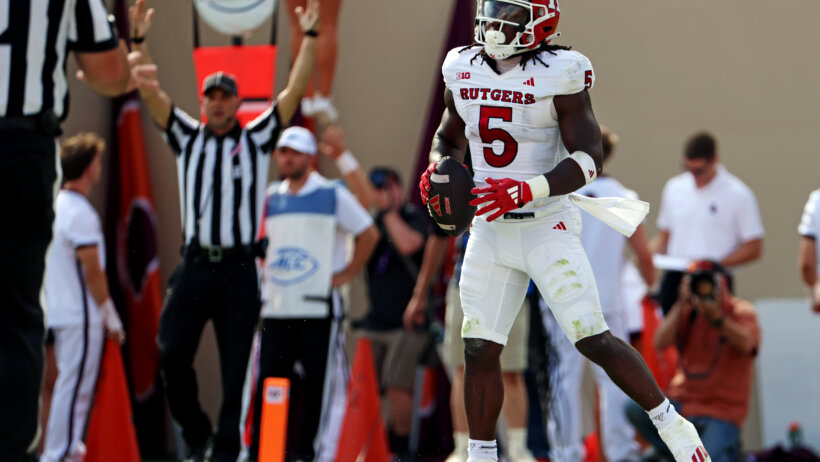 Kyle Monangai celebrates a touchdown.