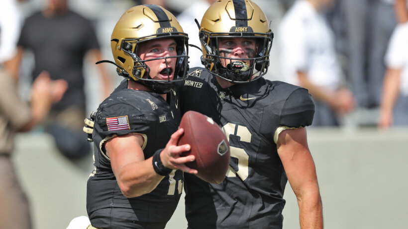 Army Black Knights quarterback Bryson Daily celebrates a run with tight end Will Montesi