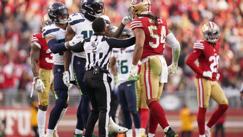 Seattle Seahawks wide receiver DK Metcalf and San Francisco 49ers linebacker Fred Warner in each other's faces