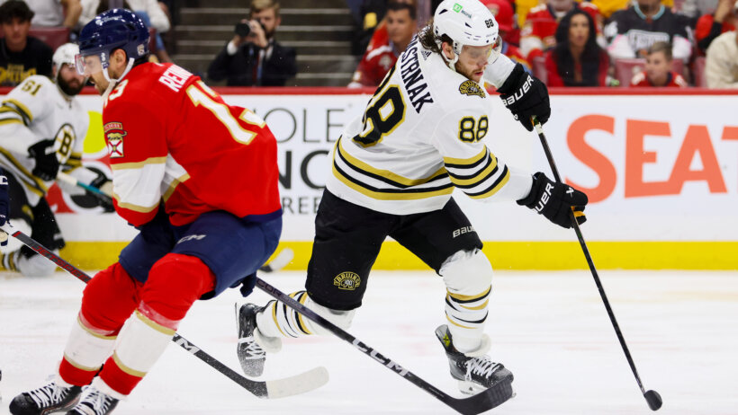 Boston Bruins right wing David Pastrnak moves the puck against Florida Panthers center Sam Reinhart