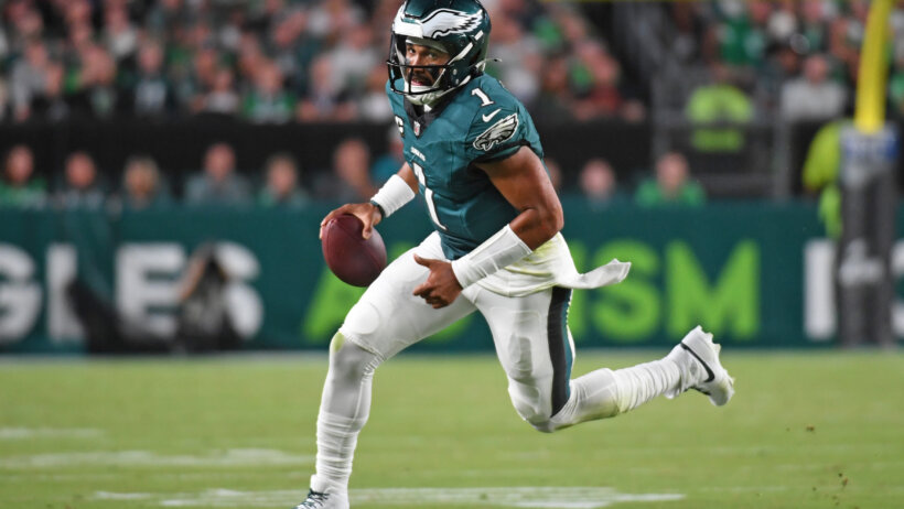 Philadelphia Eagles quarterback Jalen Hurts runs with the football