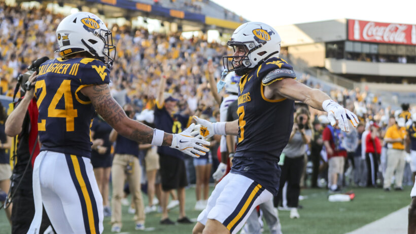 Virginia Mountaineers wide receiver Rodney Gallagher III celebrates with West Virginia Mountaineers wide receiver Hudson Clemen