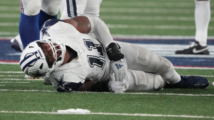 Dallas Cowboys linebacker Micah Parsons laying on the ground injured