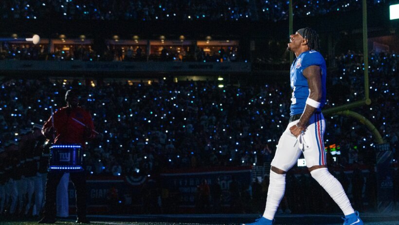 New York Giants wide receiver Malik Nabers walking onto the field