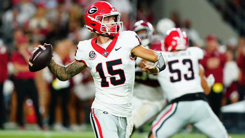 Carson Beck fires a pass versus Alabama.