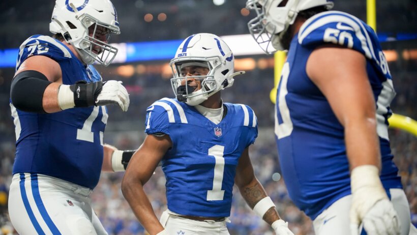 Josh Downs celebrating with his teammates