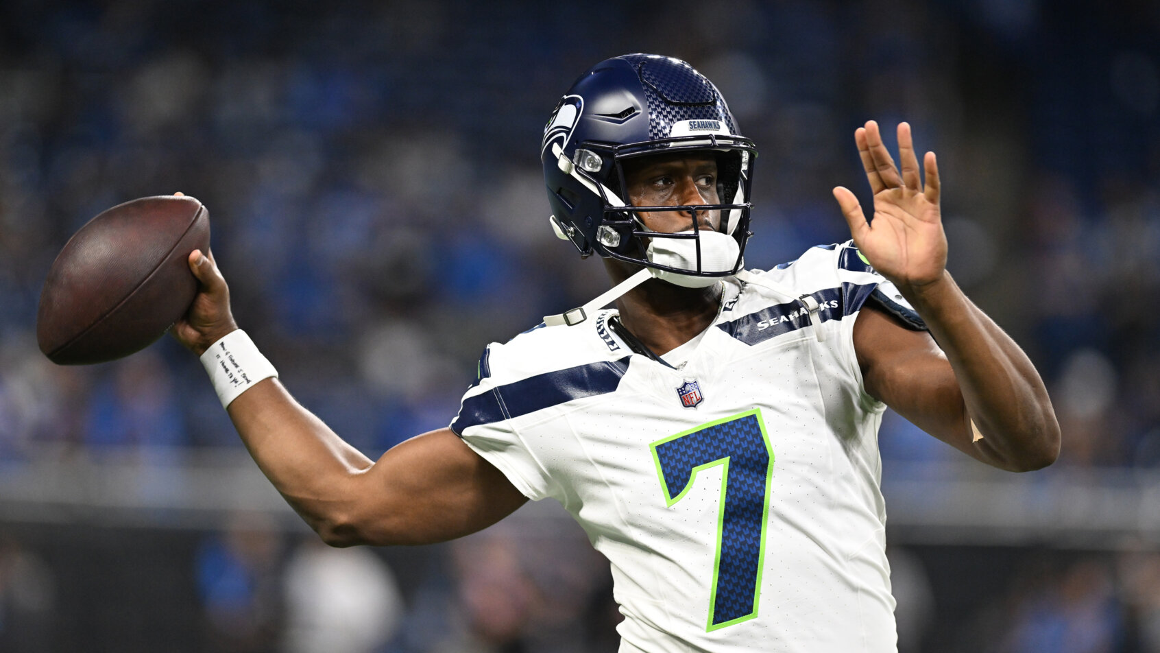 Seattle Seahawks quarterback Geno Smith throws passes