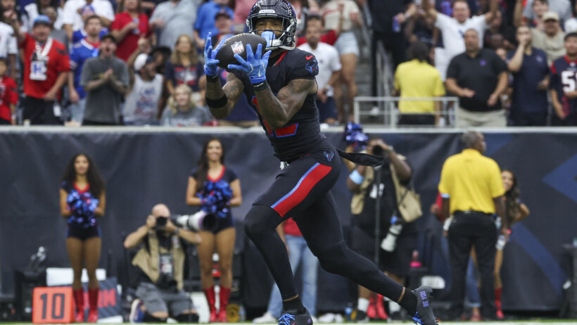 Houston Texans wide receiver Nico Collins catching a pass