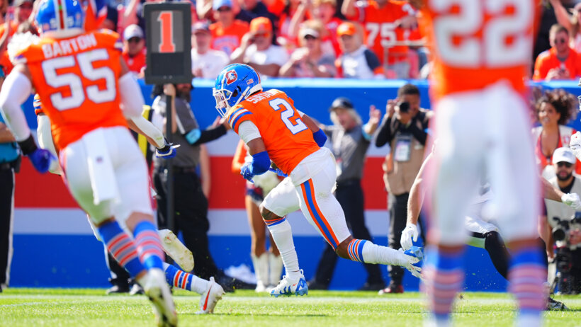 Pat Surtain running after intercepting a pass