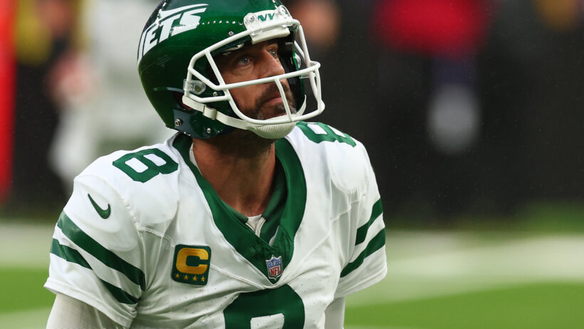Aaron Rodgers picks himself up after throwing an incompletion.