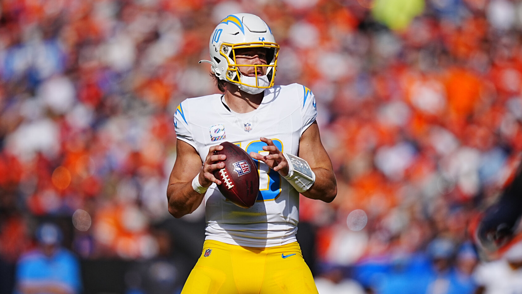 Los Angeles Chargers quarterback Justin Herbert holding the ball in the pocket
