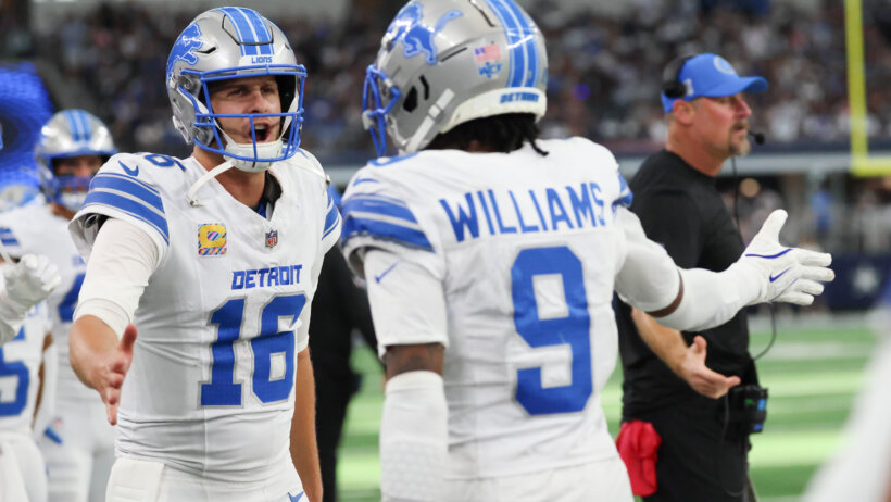 Detroit Lions wide receiver Jameson Williams celebrates with Detroit Lions quarterback Jared Goff