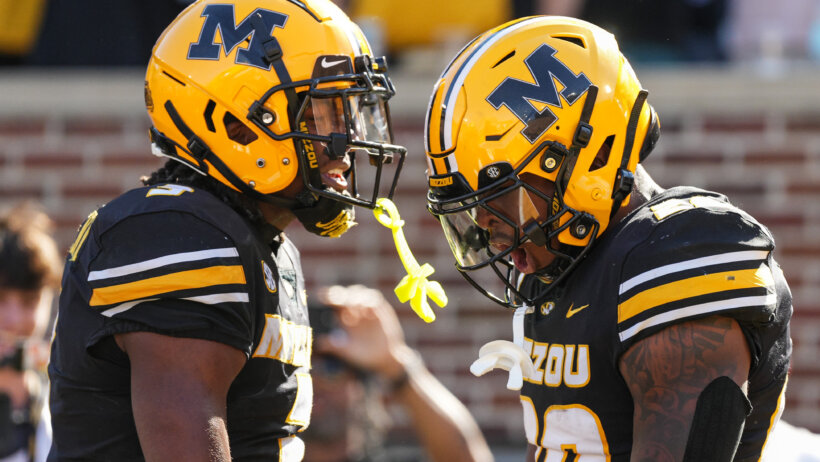 Missouri Tigers wide receiver Luther Burden III (3) and running back Jamal Roberts celebrate after a touchdown