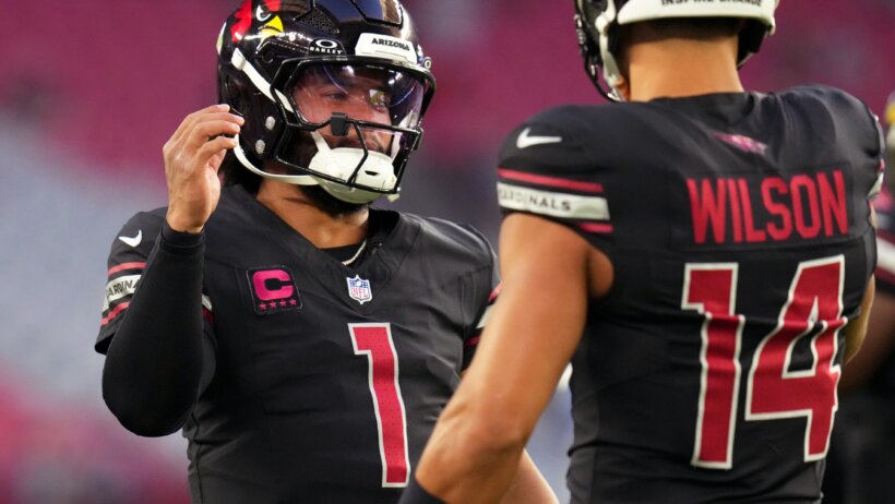 Kyler Murray celebrating with a teammate