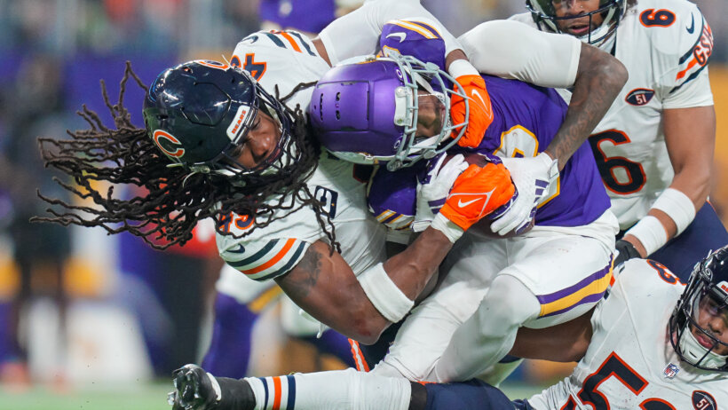 Chicago Bears linebacker Tremaine Edmunds tackling Minnesota Vikings wide receiver Jordan Addison