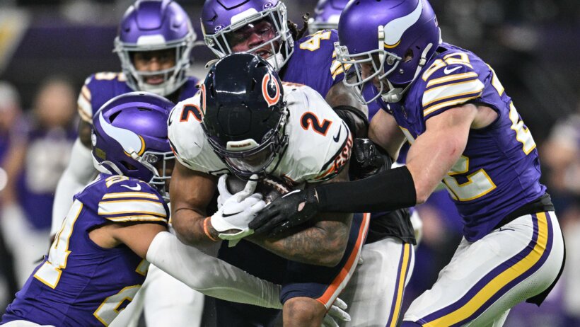 Chicago Bears wide receiver DJ Moore tackled by several Minnesota Viking defenders