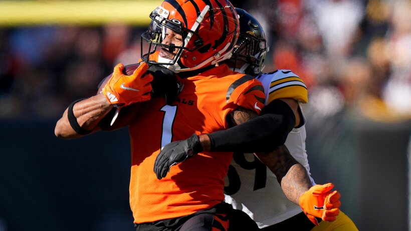 Cincinnati Bengals wide receiver Ja'Marr Chase getting tackled by Pittsburgh Steelers free safety Minkah Fitzpatrick