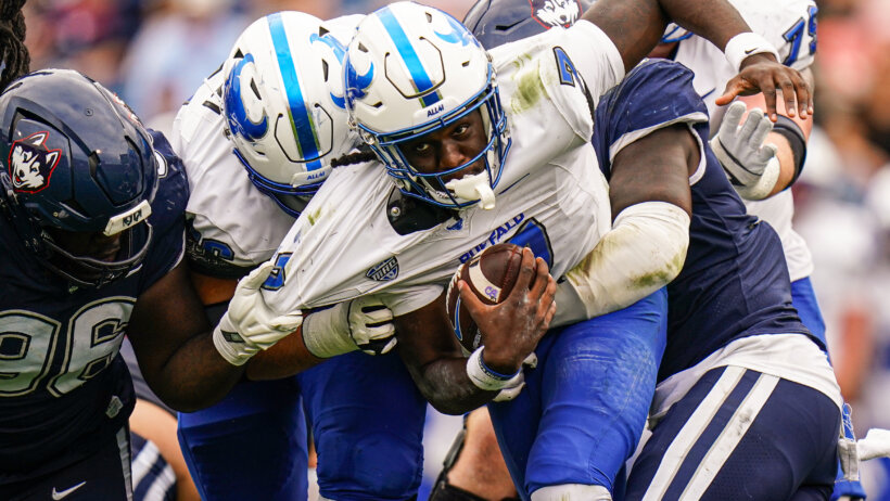 Buffalo Bulls quarterback C.J. Ogbonna runs with the ball