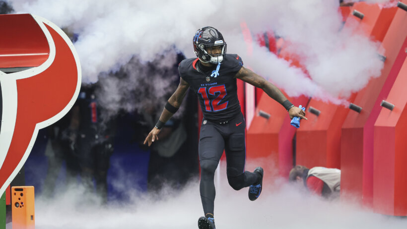 Houston Texans wide receiver Nico Collins running out of the tunnel
