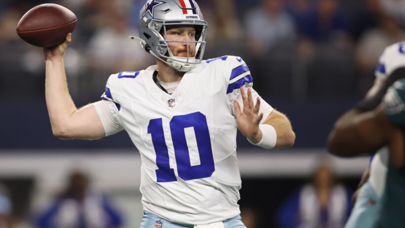Dallas Cowboys quarterback Cooper Rush throwing a pass
