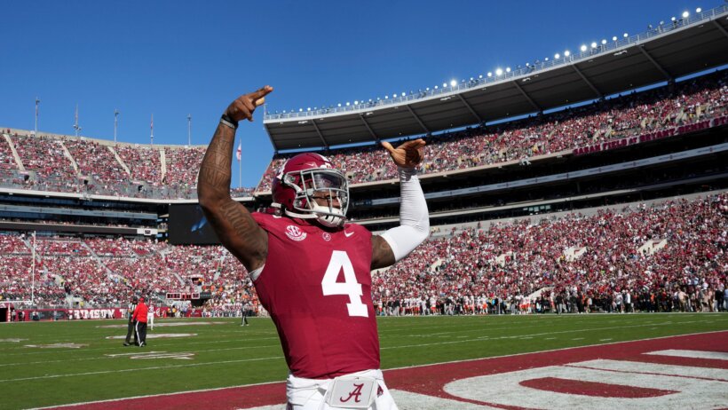 Alabama Crimson Tide quarterback Jalen Milroe gestures to fans