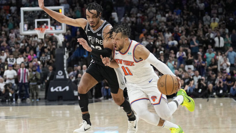 New York Knicks guard Jalen Brunson driving to the hoop against San Antonio Spurs guard Tre Jones