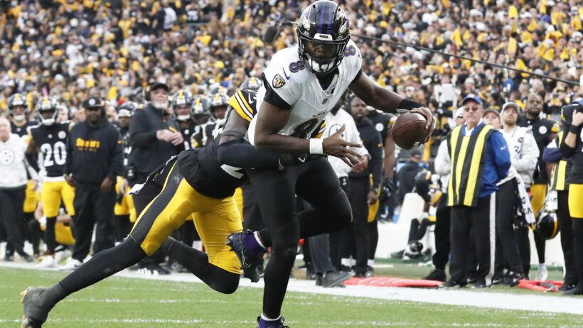 Pittsburgh Steelers cornerback Joey Porter Jr tackling Baltimore Ravens quarterback Lamar Jackson