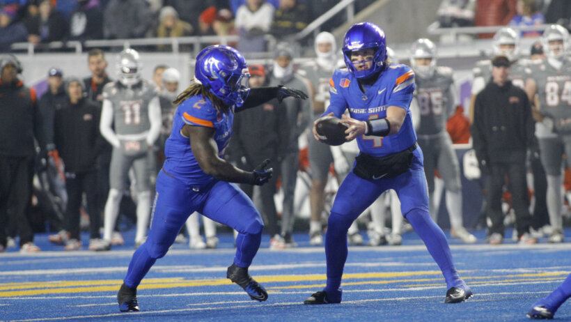 Boise State Broncos quarterback Maddux Madsen hands off to running back Ashton Jeanty