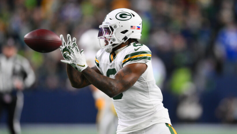 Green Bay Packers running back Josh Jacobs catching a pass
