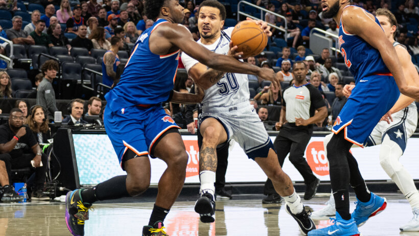 Orlando Magic guard Cole Anthony drives to the basket as New York Knicks forward OG Anunoby defends