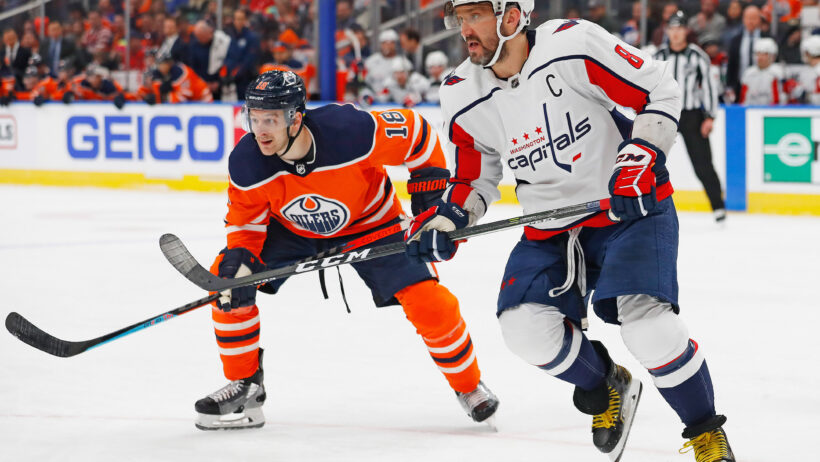 Alex Ovechkin and Zach Hyman look for a loose puck