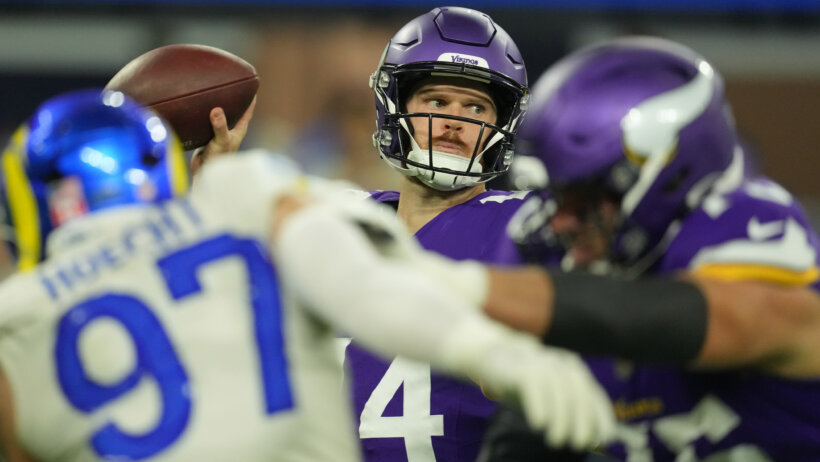 Minnesota Vikings quarterback Sam Darnold throwing from the pocket