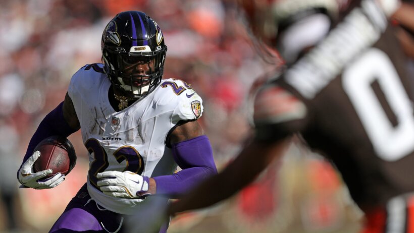 Baltimore Ravens running back Derrick Henry carrying the ball against the Cleveland Browns