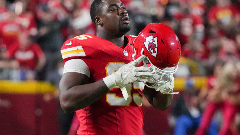 Chris Jones putting on helmet