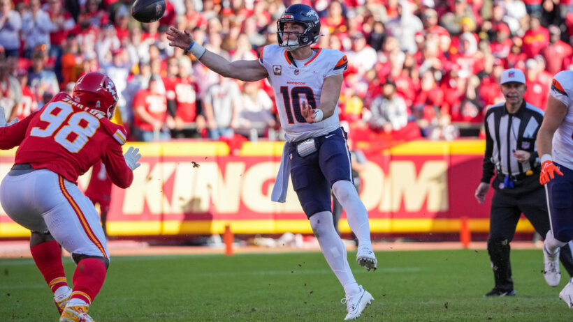 Denver Broncos quarterback Bo Nix throwing a pass on the run