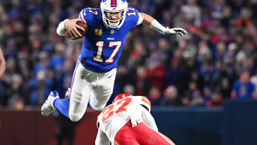 Buffalo Bills quarterback Josh Allen leaps over Kansas City Chiefs safety