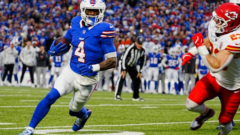 Buffalo Bills' James Cook runs with the ball, chased by Kansas City Chiefs' Drue Tranquill