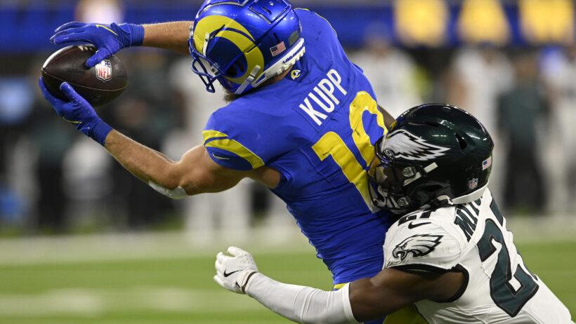 Los Angeles Rams wide receiver Cooper Kupp catching a pass as Philadelphia Eagles cornerback Quinyon Mitchell defends