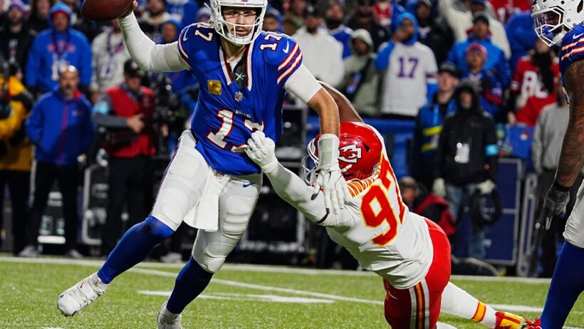 Kansas City's Felix Anundike-Uzomah tries to tackle Buffalo Bills quarterback Josh Allen