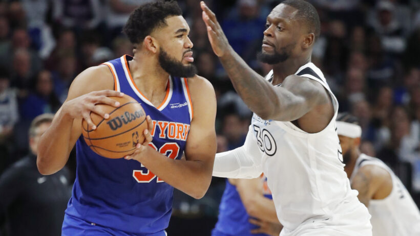 Karl-Anthony Towns is guarded by Julius Randle.