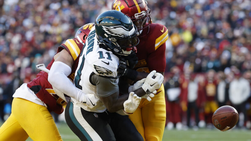 Philadelphia Eagles wide receiver A.J. Brown getting hit by Washington Commanders safety Quan Martin