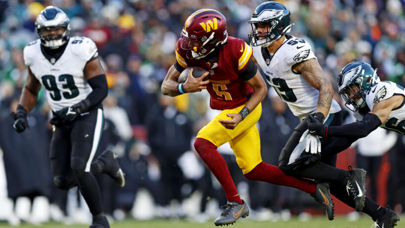 Washington Commanders quarterback Jayden Daniels runs with the ball against the Philadelphia Eagles